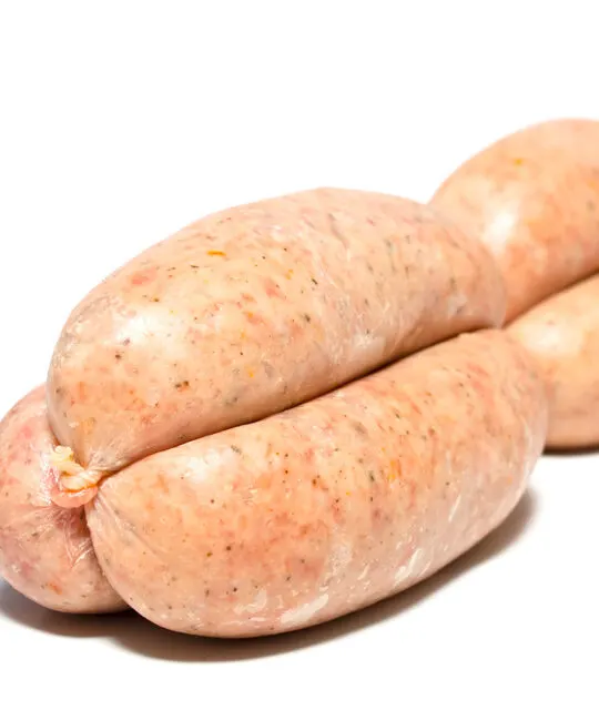 Homemade linked pork sausages on a white background