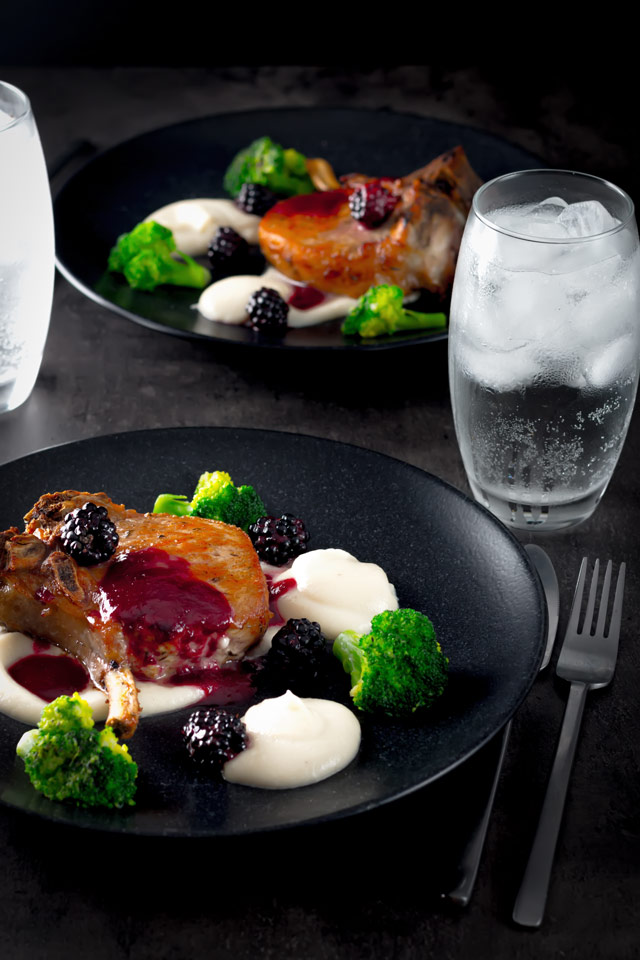 Pork Chops with Jerusalem Artichoke Puree Pork chops are served along side a silky Jerusalem artichoke puree with a cider and blackberry sauce on this perfect late summer early autumn dish.