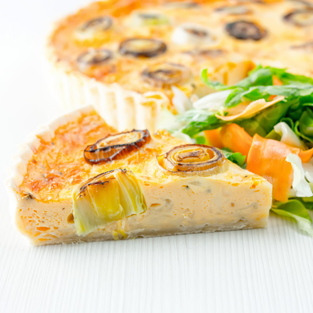 Leek and Gruyere Quiche This Leek and Gruyere Quiche is a little play on the classic idea of a cheese and onion quiche using nutty almost smoky Gruyere cheese & charred leeks.