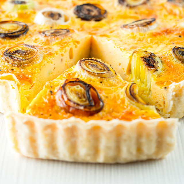 Leek and Gruyere Quiche This Leek and Gruyere Quiche is a little play on the classic idea of a cheese and onion quiche using nutty almost smoky Gruyere cheese & charred leeks.