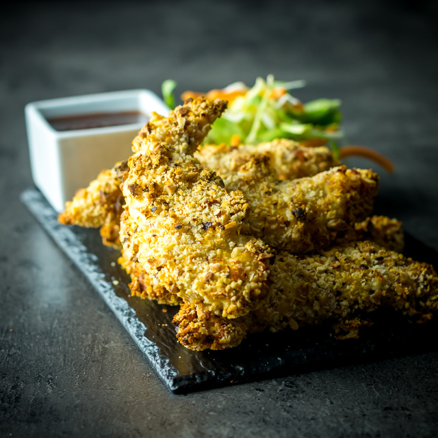 Baked Hazelnut Chicken Tenders with Spicy Dipping Sauce These Baked Hazelnut Chicken Tenders come bundled with a Spicy Dipping Sauce and can be munched on just 25 minutes after opening your cupboard!
