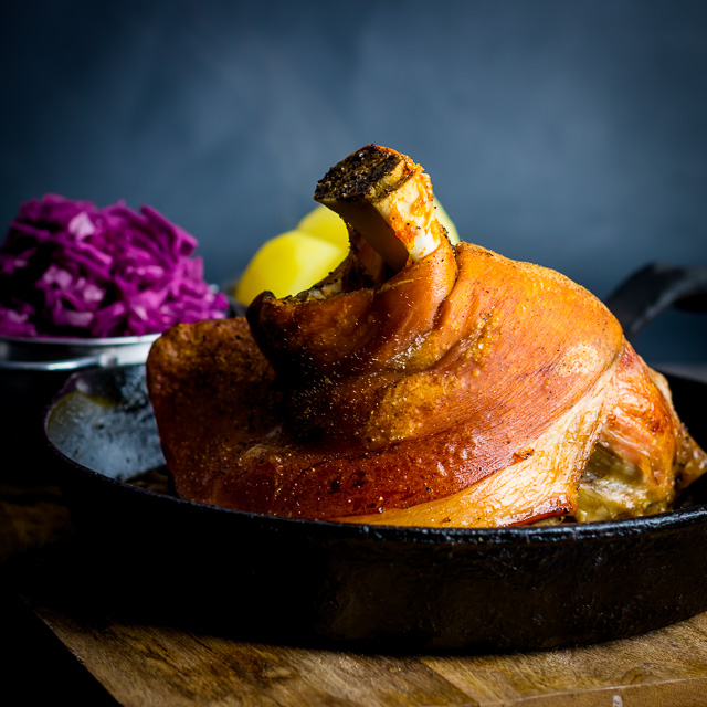 Crispy Beer Roasted Pork Knuckle With Red Cabbage Popular across all of central Europe my version of beer roasted pork knuckle has definite Hungarian leanings with dark beer and caraway seeds.