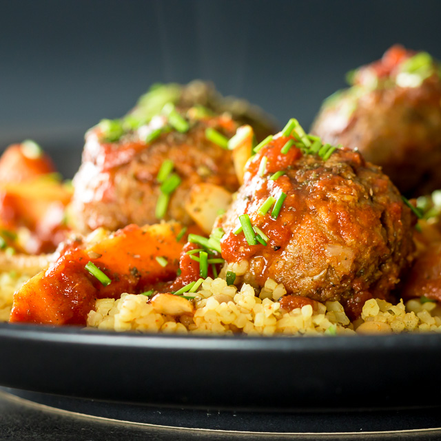 Moroccan Beef Meatballs with Bulgar Wheat and Chickpeas The bed of Harissa spiked bulgar wheat and chickpeas is the perfect bed for these Moroccan inspired beef meatballs, a wonderful winter warmer!
