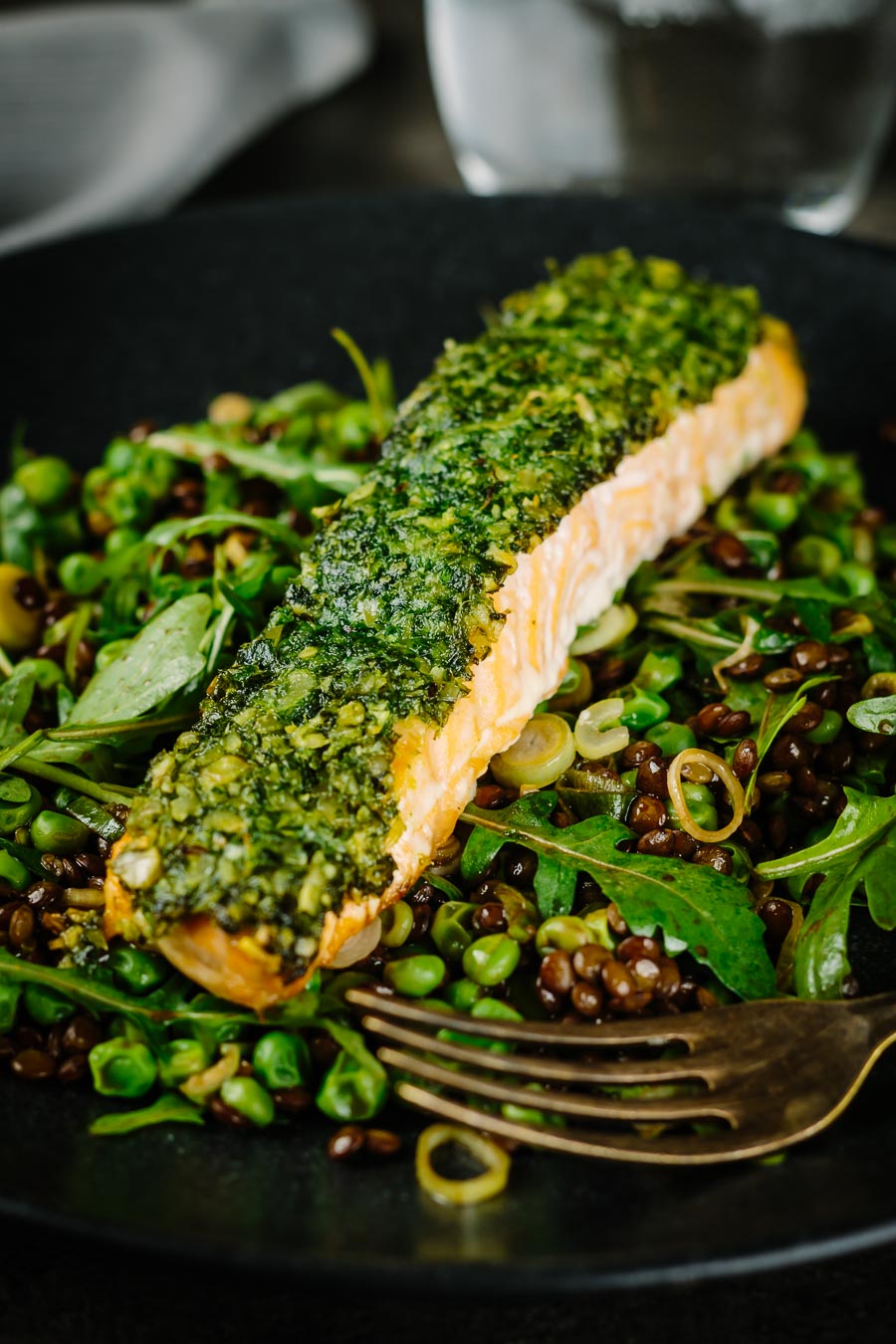 Herb Crusted Baked Salmon With Peas and Rocket Baked salmon is a beautiful thing and this herb crust salmon is served with a vibrant green warm lentil salad and a simple but great balsamic dressing.