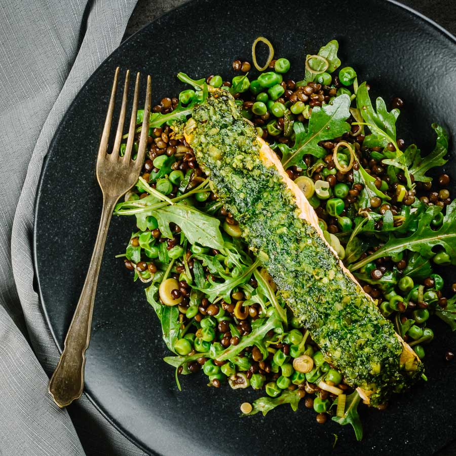 Herb Crusted Baked Salmon With Peas and Rocket Baked salmon is a beautiful thing and this herb crust salmon is served with a vibrant green warm lentil salad and a simple but great balsamic dressing.