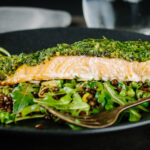 Baked salmon is a beautiful thing and this herb crust salmon is served with a vibrant green warm lentil salad and a simple but great balsamic dressing.