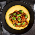 A real hearty and comforting dish, a perfect Italian sausage ragu over a rich and indulgent cheesy polenta, pass me the red wine!
