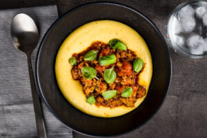 A real hearty and comforting dish, a perfect Italian sausage ragu over a rich and indulgent cheesy polenta, pass me the red wine!