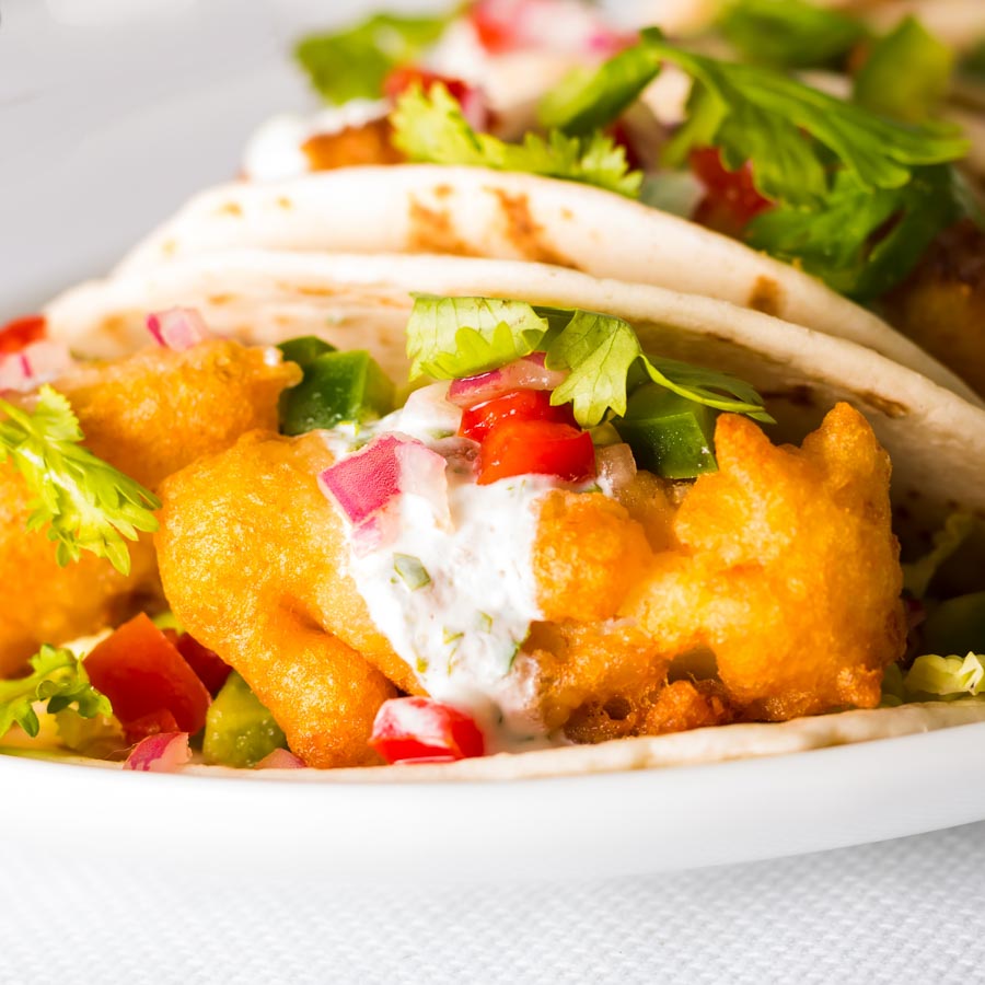 Beer Battered Fish Tacos Some glorious beer battered fish tacos that are thing of great beauty, loaded with the flavours of cumin, coriander and lime!