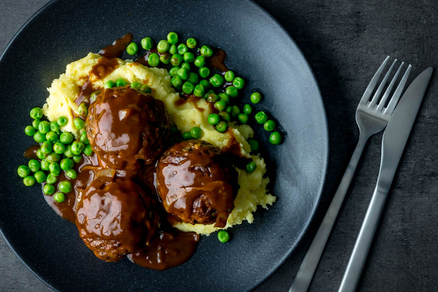 Faggots and Mash with Peas Faggots and Mash were the meatballs I grew up with a staple of the Midlands in the UK have sadly fallen out of favour but these old skool classics are still my favourite!