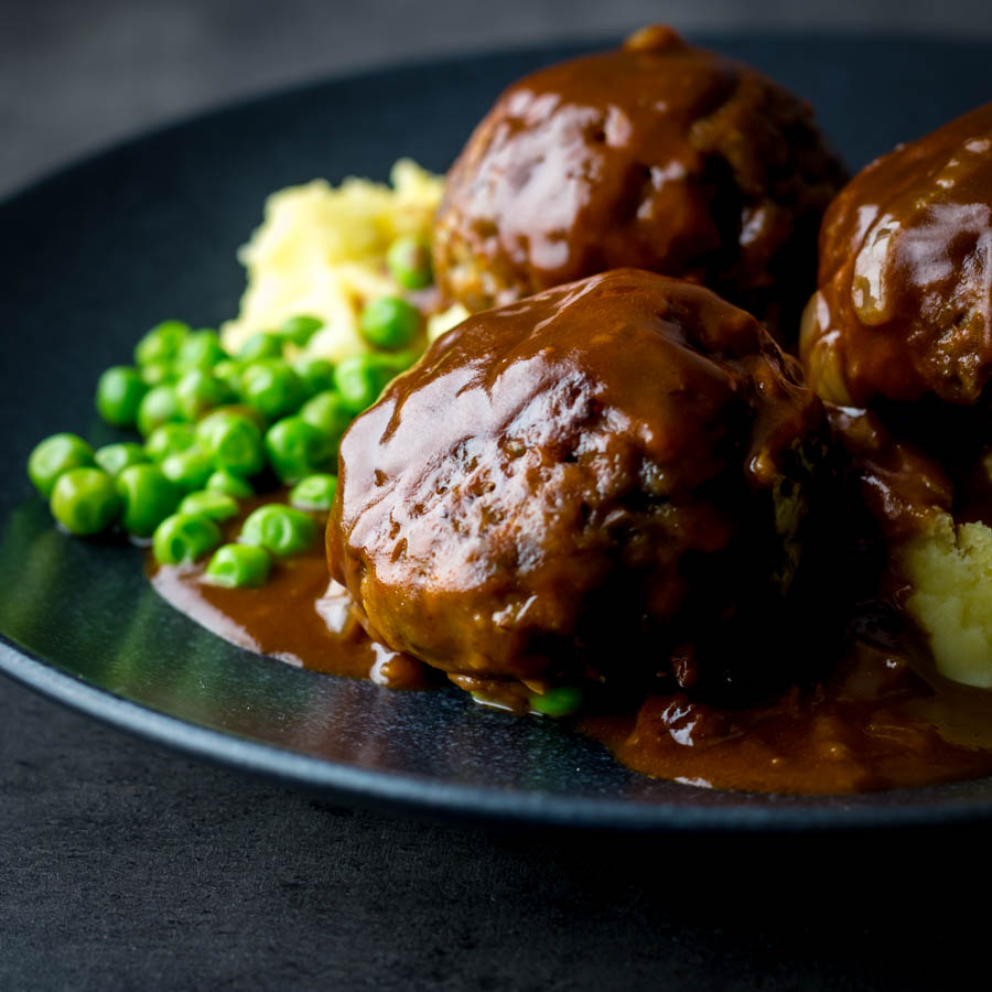 Faggots and Mash with Peas Faggots and Mash were the meatballs I grew up with a staple of the Midlands in the UK have sadly fallen out of favour but these old skool classics are still my favourite!