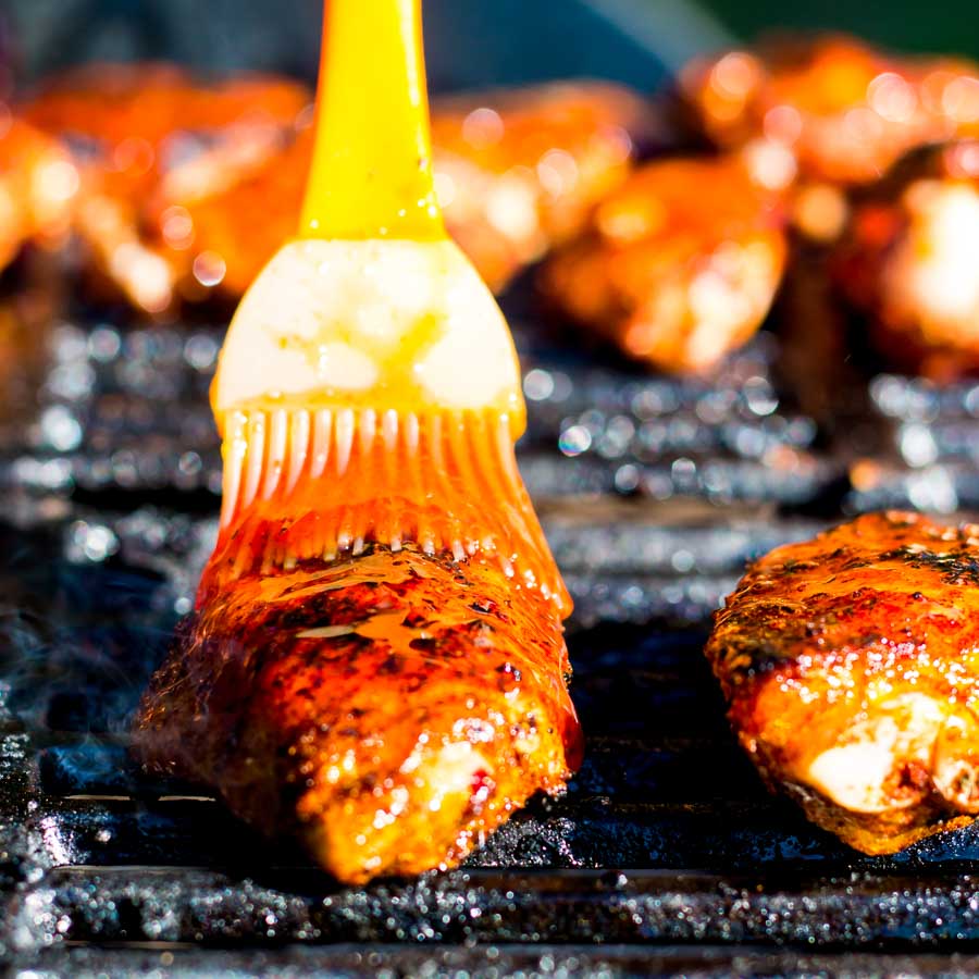Sriracha Glazed Grilled Chicken Wings These Sriracha Glazed Grilled Chicken Wings are marinaded in a dry rub before being grilled on the BBQ in a sticky spicy sweet sauce to send them over the edge.