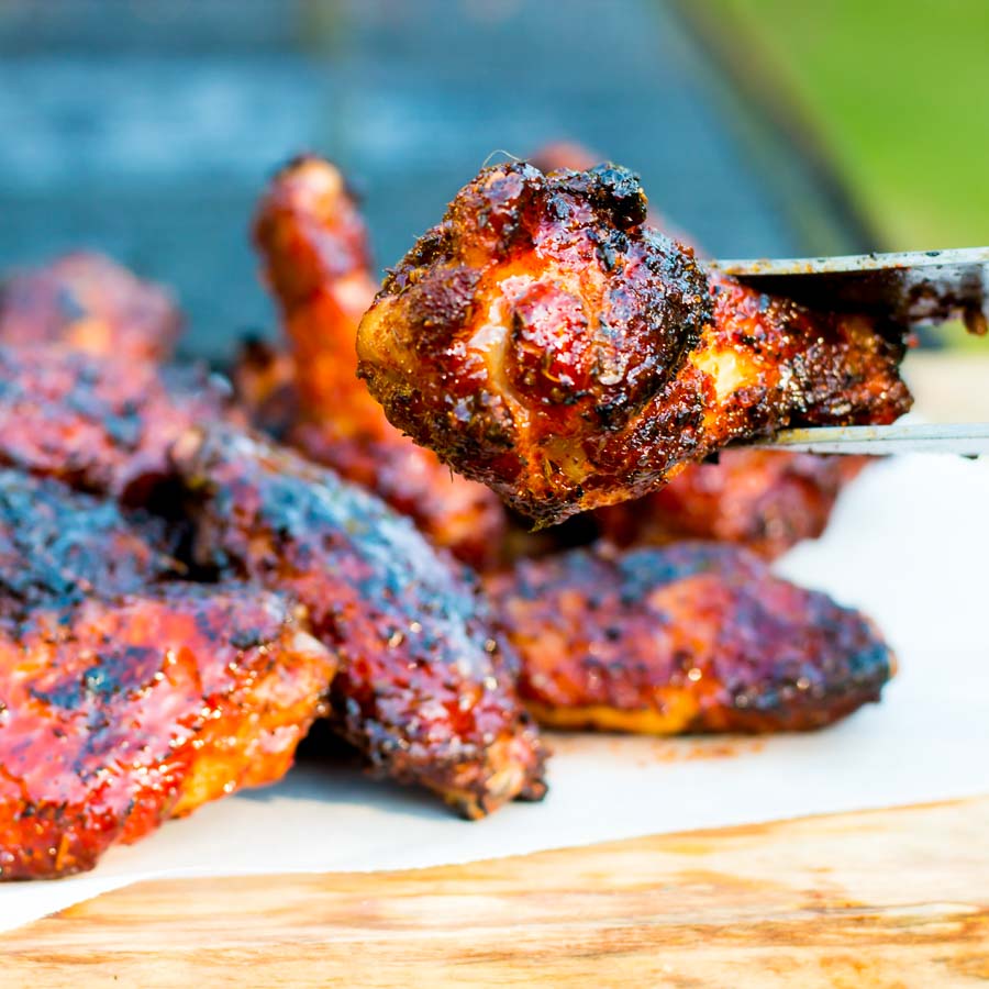 Sriracha Glazed Grilled Chicken Wings These Sriracha Glazed Grilled Chicken Wings are marinaded in a dry rub before being grilled on the BBQ in a sticky spicy sweet sauce to send them over the edge.