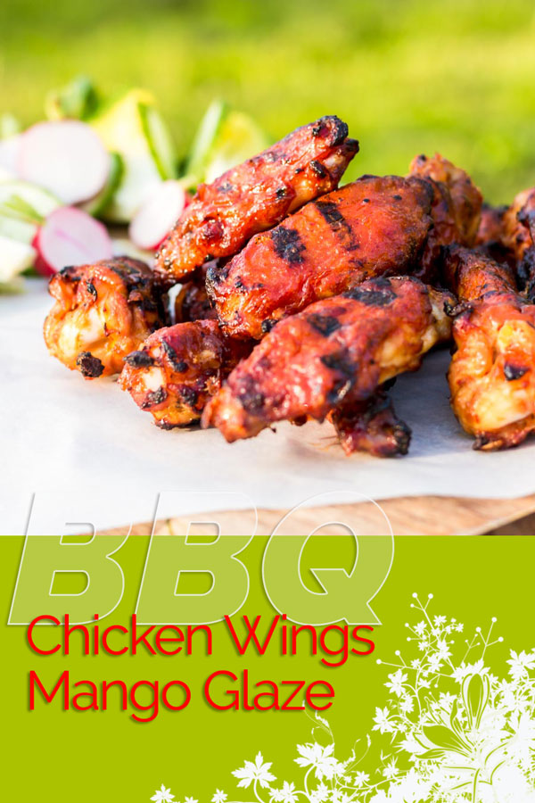 BBQ Chicken Wings are always a thing of great beauty, but the Mango Glaze on these bad boys push them right over the top and are the perfect kick-off to the BBQ Season! #chicken #chickenwings #hotwings #buffalowings #grilling #BBQ #recipe #recipeoftheday #recipeideas