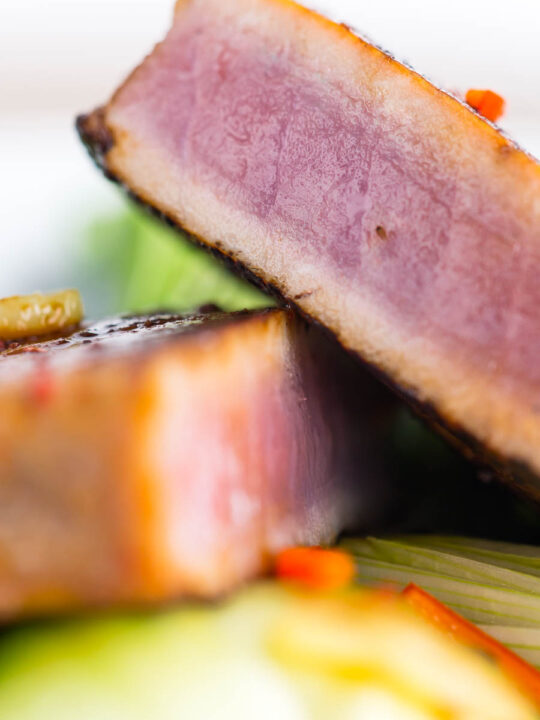 This glorious honey and soy glazed tuna steak is pimped up with a bit of chili and seared rather than cooked, it is served with some garlic braised pak choi and spring onions.