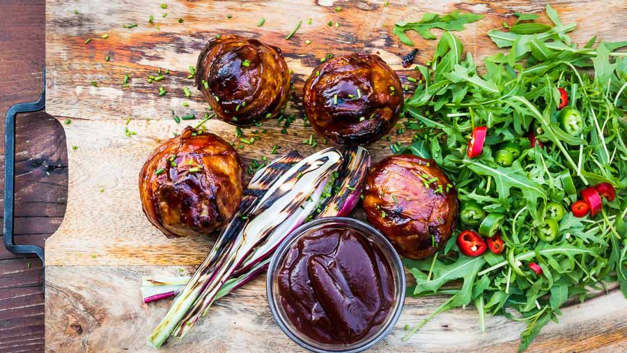 Bacon Wrapped Grilled Stuffed Onions These bacon wrapped grilled stuffed onions are insanely good, a perfect beef meatball stuffed inside an onion, then wrapped in bacon. Grilled to perfection then glazed in BBQ sauce!