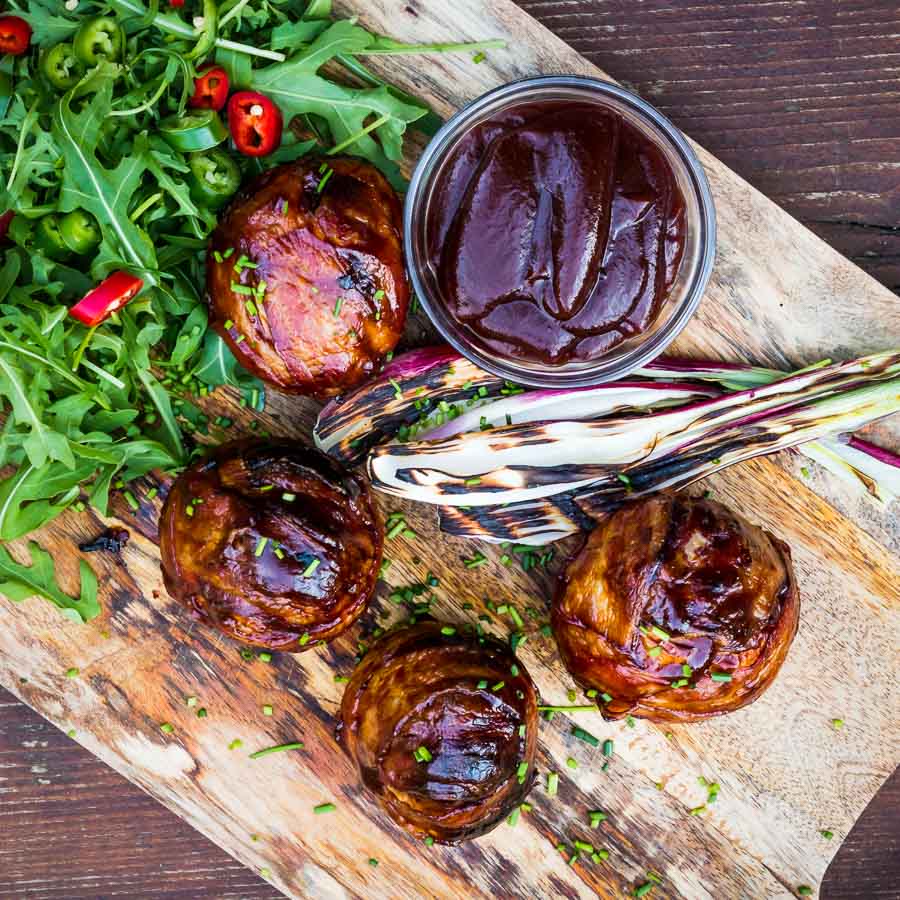 Bacon Wrapped Grilled Stuffed Onions These bacon wrapped grilled stuffed onions are insanely good, a perfect beef meatball stuffed inside an onion, then wrapped in bacon. Grilled to perfection then glazed in BBQ sauce!