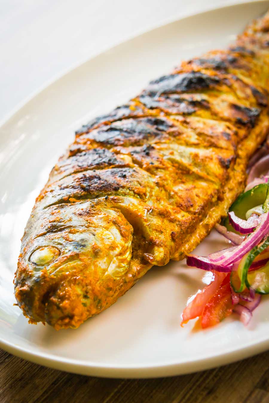 BBQ Tandoori Fish The barbecue is a great substitute for a tandoor oven as this whole BBQ tandoori fish demonstrates. A whole trout in glorious Indian Spices cooked to perfection!