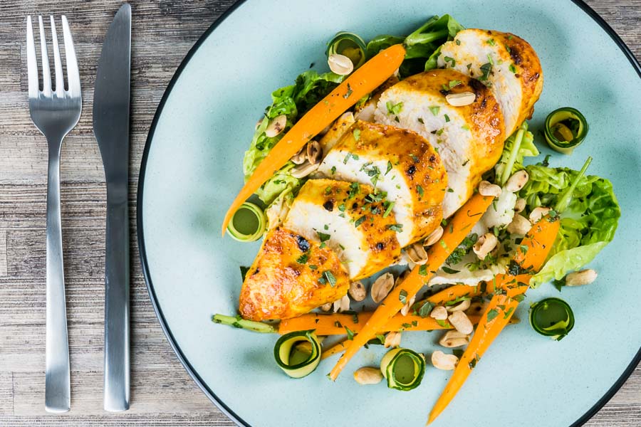 Thai Chicken Salad A simply roasted chicken breast in a Thai red curry paste and coconut milk coating form the centrepiece of this insanely tasty Thai Chicken Salad!