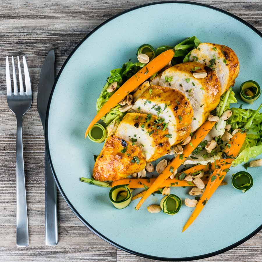 Thai Chicken Salad A simply roasted chicken breast in a Thai red curry paste and coconut milk coating form the centrepiece of this insanely tasty Thai Chicken Salad!