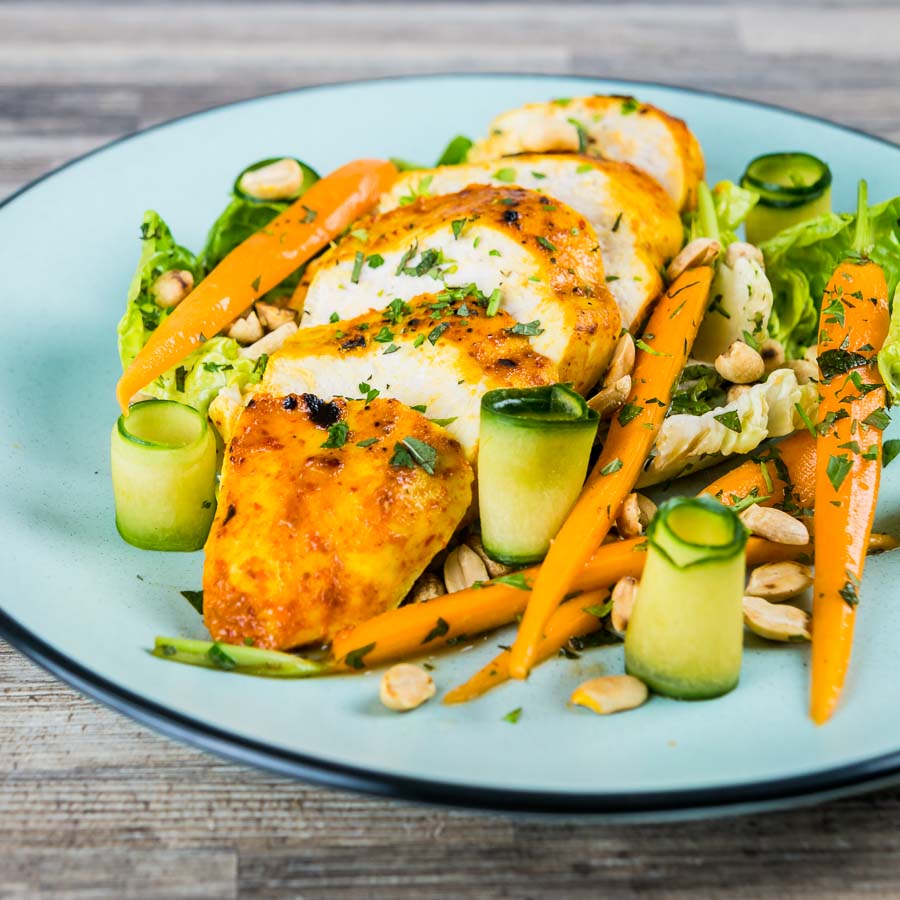 Thai Chicken Salad A simply roasted chicken breast in a Thai red curry paste and coconut milk coating form the centrepiece of this insanely tasty Thai Chicken Salad!