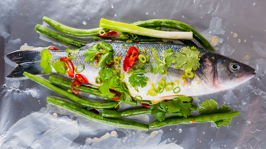 Asian Fish En Papillote (Sea Bass) This Asian Fish En Papillote features a classic French technique with bright and vibrant Asian flavours, you cannot beat a whole sea bass cooked on the bone