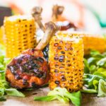 Dark Beer (a porter) and Honey form the base of the glaze on these BBQ chicken drumsticks which are served with simply grilled buttered sweetcorn.