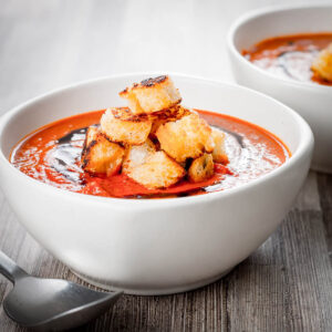 With a little bit of extra effort you can elevate a simple roasted tomato soup to a whole new taste level with hints of thyme and lots of roasted garlic.
