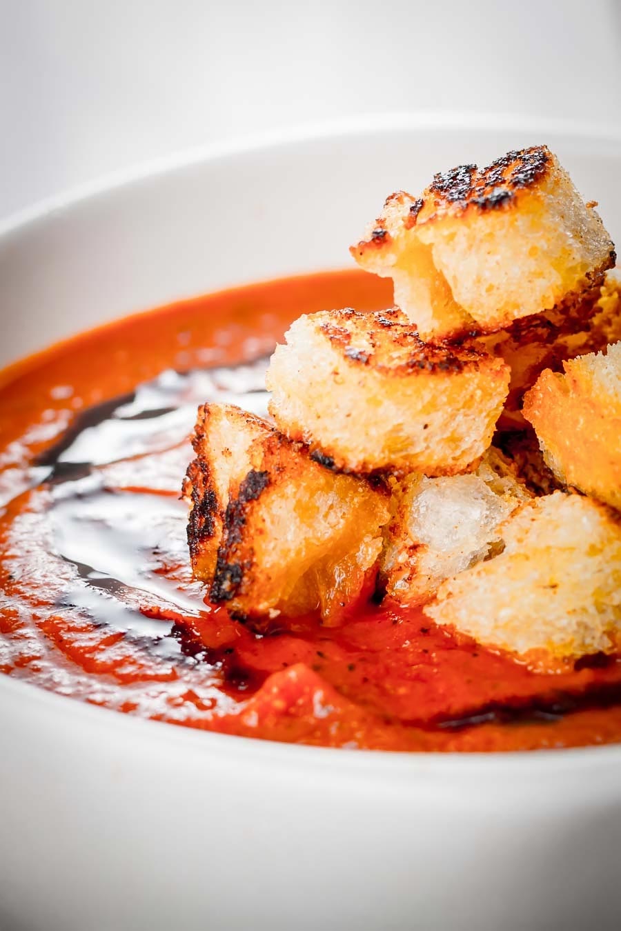 Garlicky Roasted Tomato Soup With a little bit of extra effort you can elevate a simple roasted tomato soup to a whole new taste level with hints of thyme and lots of roasted garlic.