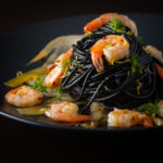 Bring a bit of bling to your spaghetti with shrimp by adding some squid ink pasta and the classics chili, garlic and lemon juice.