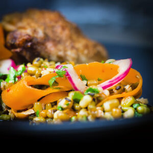 This carrot and mung bean salad is bright and vibrant with the Indian Influenced pickled carrots and served with some simply roasted garam masala chicken thighs.