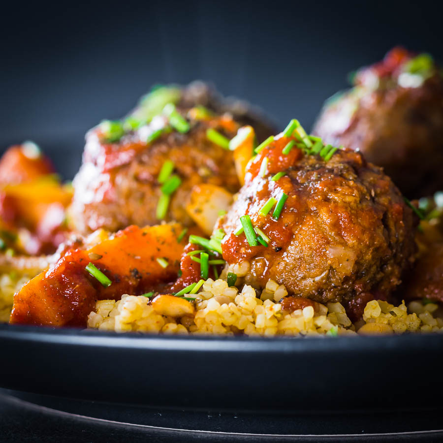Moroccan Beef Meatballs with Bulgar Wheat and Chickpeas The bed of Harissa spiked bulgar wheat and chickpeas is the perfect bed for these Moroccan inspired beef meatballs, a wonderful winter warmer!