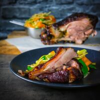This Chinese Braised Ham Hock recipe is cooked in a black bean sauce based stock and then flashed in the oven for a beautifully glazed finish.