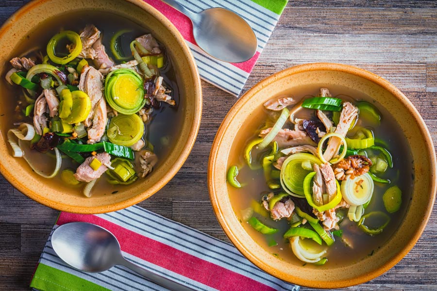 Recipes for CockaLeekie soup or Cock a Leekie soup date back to the 1500’s and my version embraces the traditional use of prunes and pearl barley and is a real winter warmer!