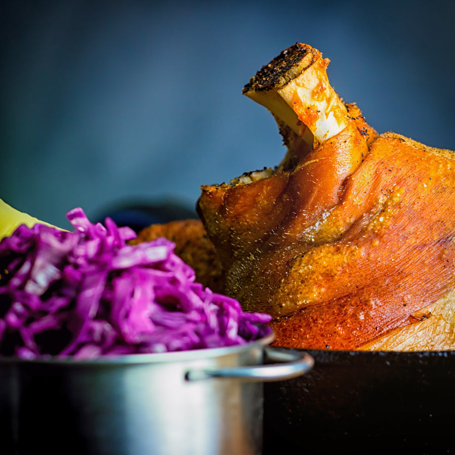 Crispy Beer Roasted Pork Knuckle With Red Cabbage Popular across all of central Europe my version of beer roasted pork knuckle has definite Hungarian leanings with dark beer and caraway seeds.