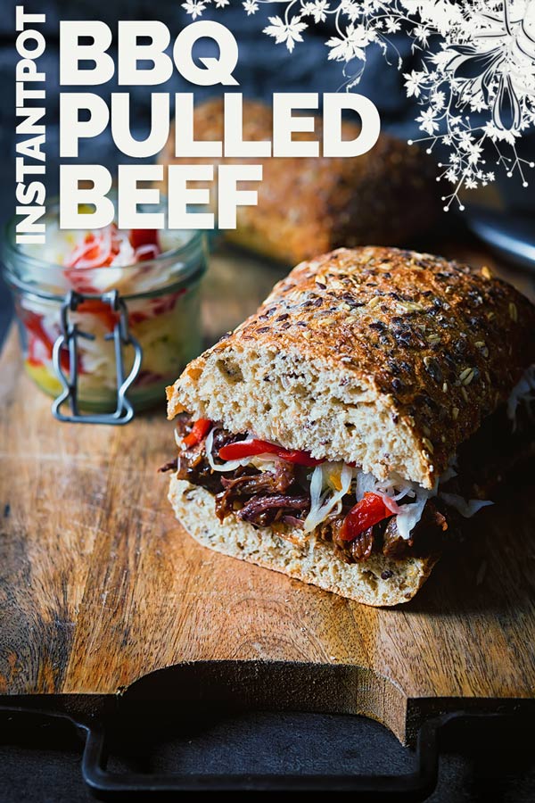 This soft and wonderfully flavoursome BBQ pulled beef is cooked in the Instant Pot and served with a quickened Hungarian pickled cabbage csalamádé and it makes a perfect sandwich filling! #beef #pulledbeef #beefrecipes #instantpotresipes #instantpot #recipe #recipeideas #recipeoftheday