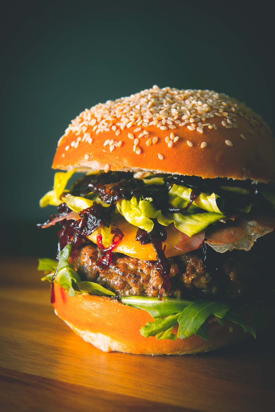 This Veal Burger is my idea of a real indulgent treat, a ground rose veal patty is accompanied by nutty Gouda cheese, Parma Ham and sticky cooked Onions.