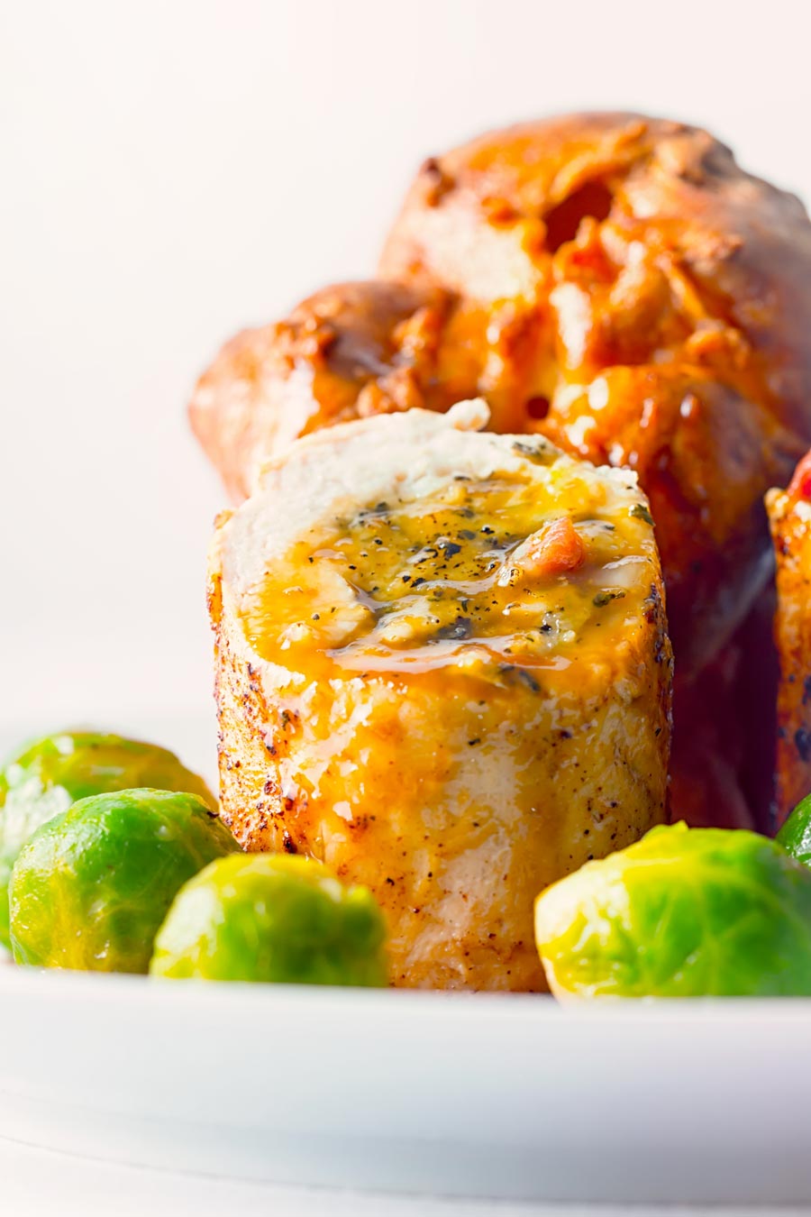 This Poached Sage and Onion Stuffed Chicken Breast recipe and is a lightened up and hurried up take on a traditional British chicken dinner.