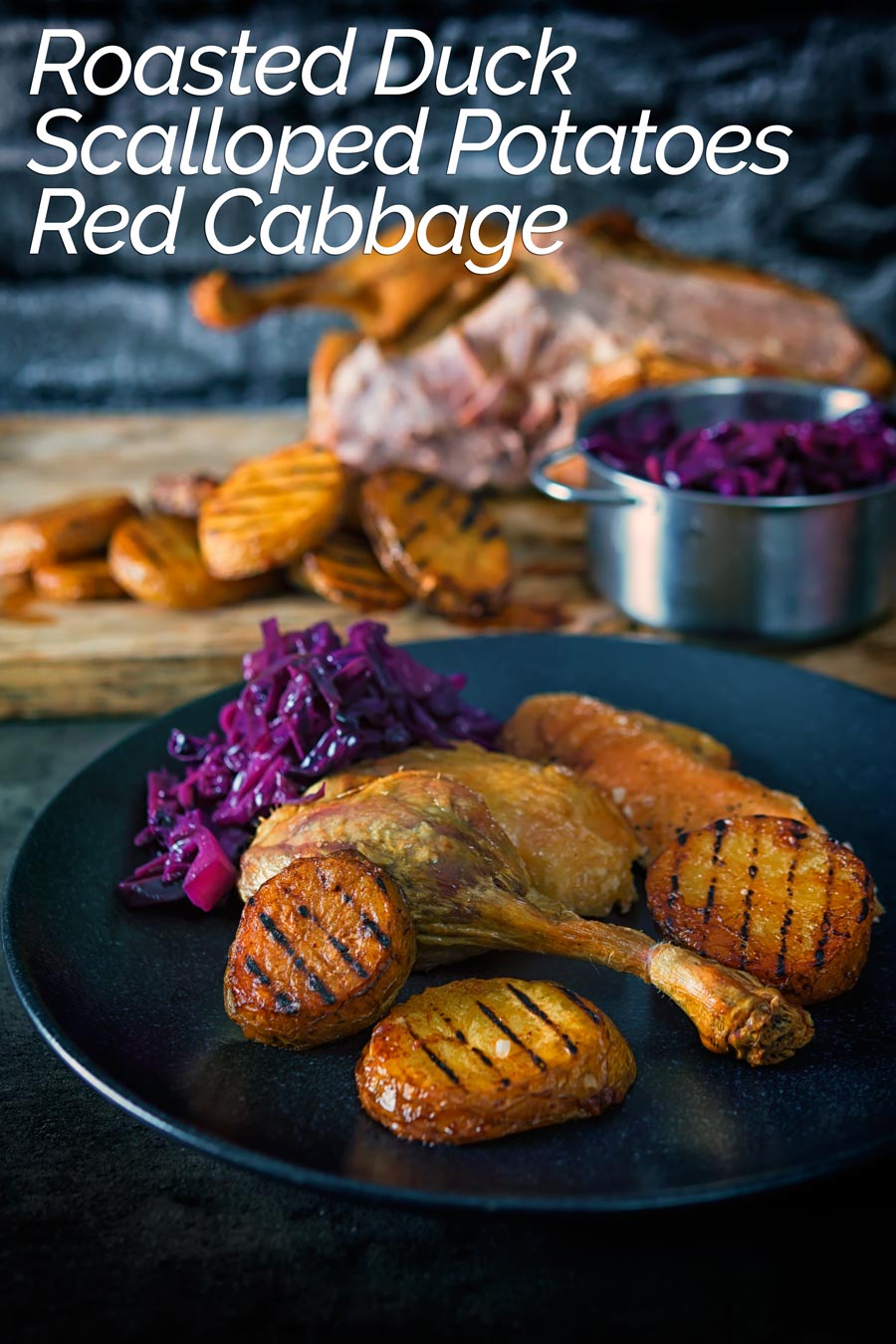 A whole roast duck always feels special and this recipe comes bundled with red cabbage and the very best potato recipe that I know! #duckrecipes #roastduckrecipe #whole #roastedduck #confitpotatoes #recipe #recipedieas #recipeoftheday