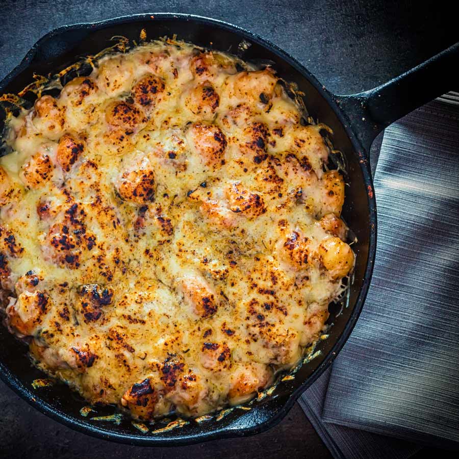 This cheesy Cheesy Gnocchi Bake is the perfect simple home cooked meal, a zingy tomato sauce and lots of melted cheese, what's not to love?