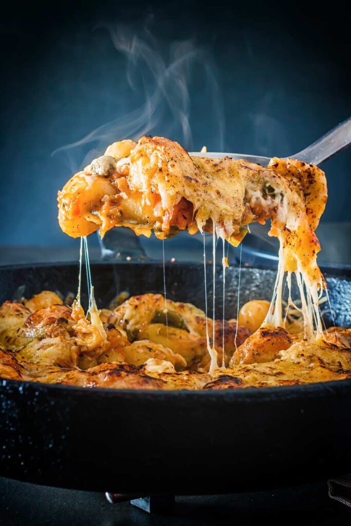 Steaming hot baked gnocchi with string cheese