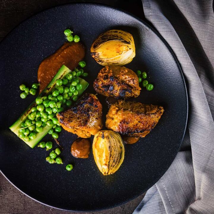 This Indian duck curry is inspired by tikka Masala and features grilled marinaded duck breast with a tamarind and honey sauce, cucumber and peas!