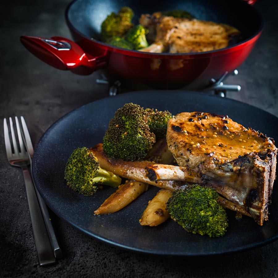 These honey mustard pork chops are baked in the oven together with parsnips and broccoli to create a simple but stunningly tasty complete meal.