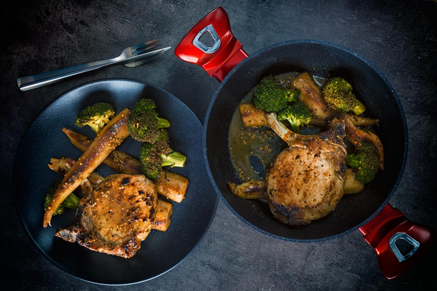 These honey mustard pork chops are baked in the oven together with parsnips and broccoli to create a simple but stunningly tasty complete meal.