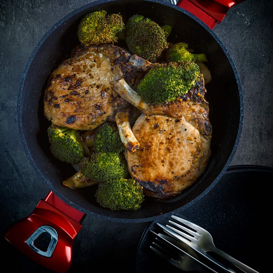 These honey mustard pork chops are baked in the oven together with parsnips and broccoli to create a simple but stunningly tasty complete meal.