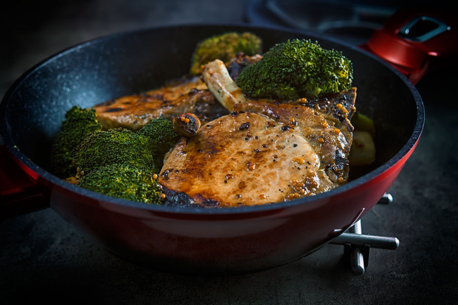 These honey mustard pork chops are baked in the oven together with parsnips and broccoli to create a simple but stunningly tasty complete meal.