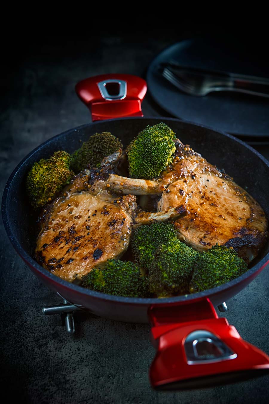 These honey mustard pork chops are baked in the oven together with parsnips and broccoli to create a simple but stunningly tasty complete meal.