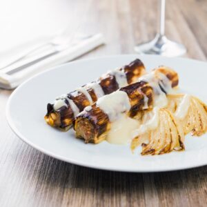 These leeks are wrapped around a mixture of pork, pine nuts, fennel and thyme and matched up with a fantastic pear and cider sauce!