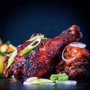 Finger Licking Sticky Chicken Drumsticks coated with a rich and dark glaze heavy with chili and a secret ingredient! Perfect for the oven but would work equally well on a BBQ!