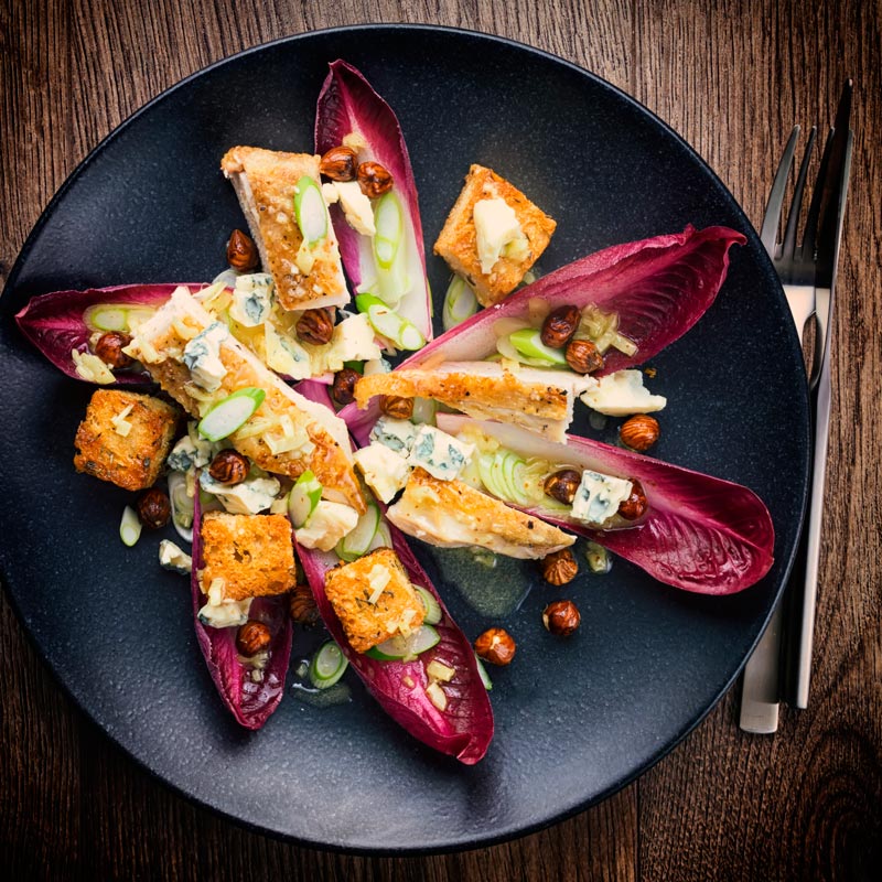 This Radicchio Salad is a perfect light winter main course salad, featuring Chicken, Hazelnuts and Blue Cheese it is loaded with the best winter produce.
